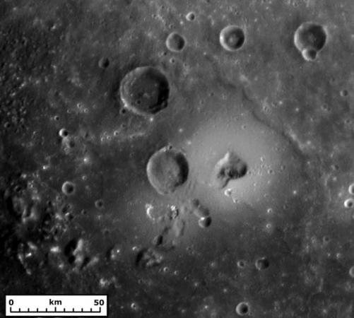 Volcanic Clue - Scientists led by Brown planetary geologist Jim Head zeroed in on this kidney-shaped volcanic vent (at right and center), surrounded by a halo-like ring and a fainter outer ring, to help confirm that Mercury's surface had been formed by volcanic activity early in the planet's history. The image was taken by the MESSENGER spacecraft as it flew past Mercury in January 2008.